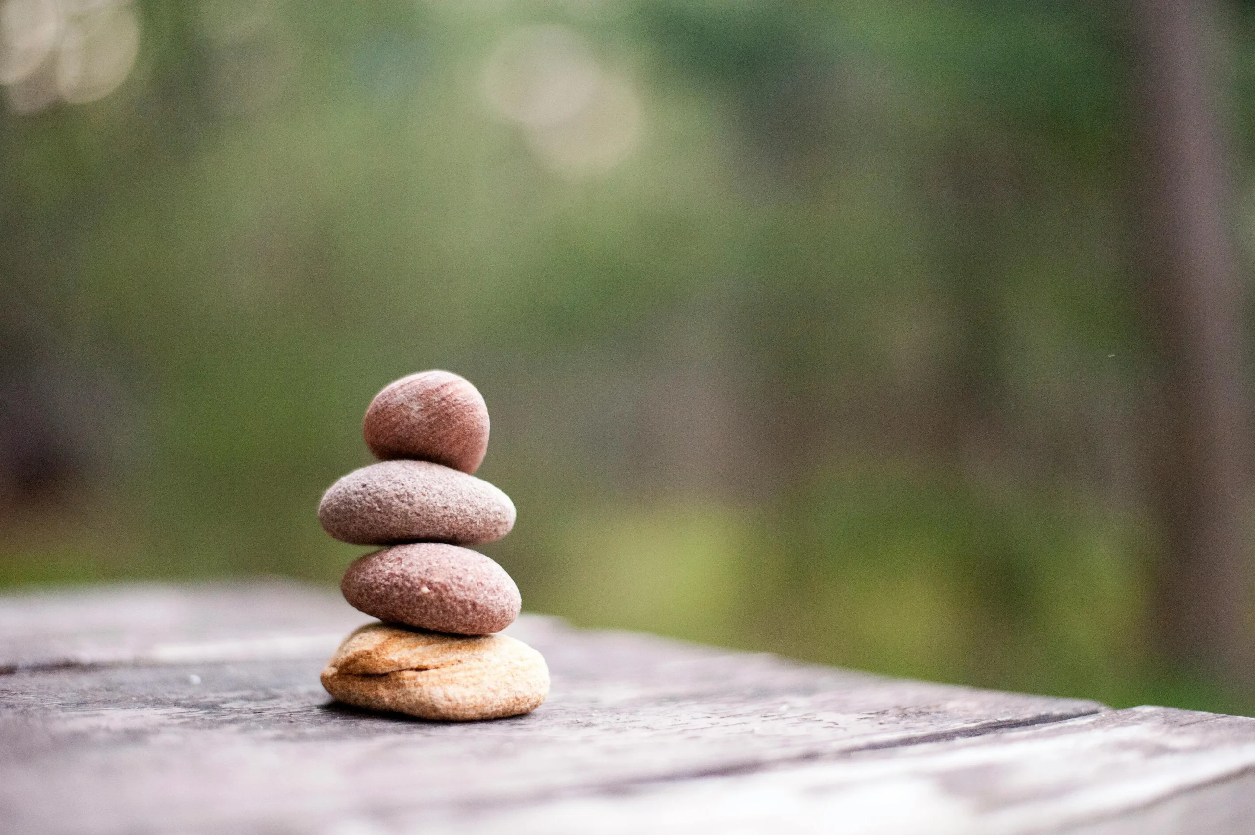 Pile of rocks symbolising balance, calm & connection obtained through ACT Therapy Calgary
