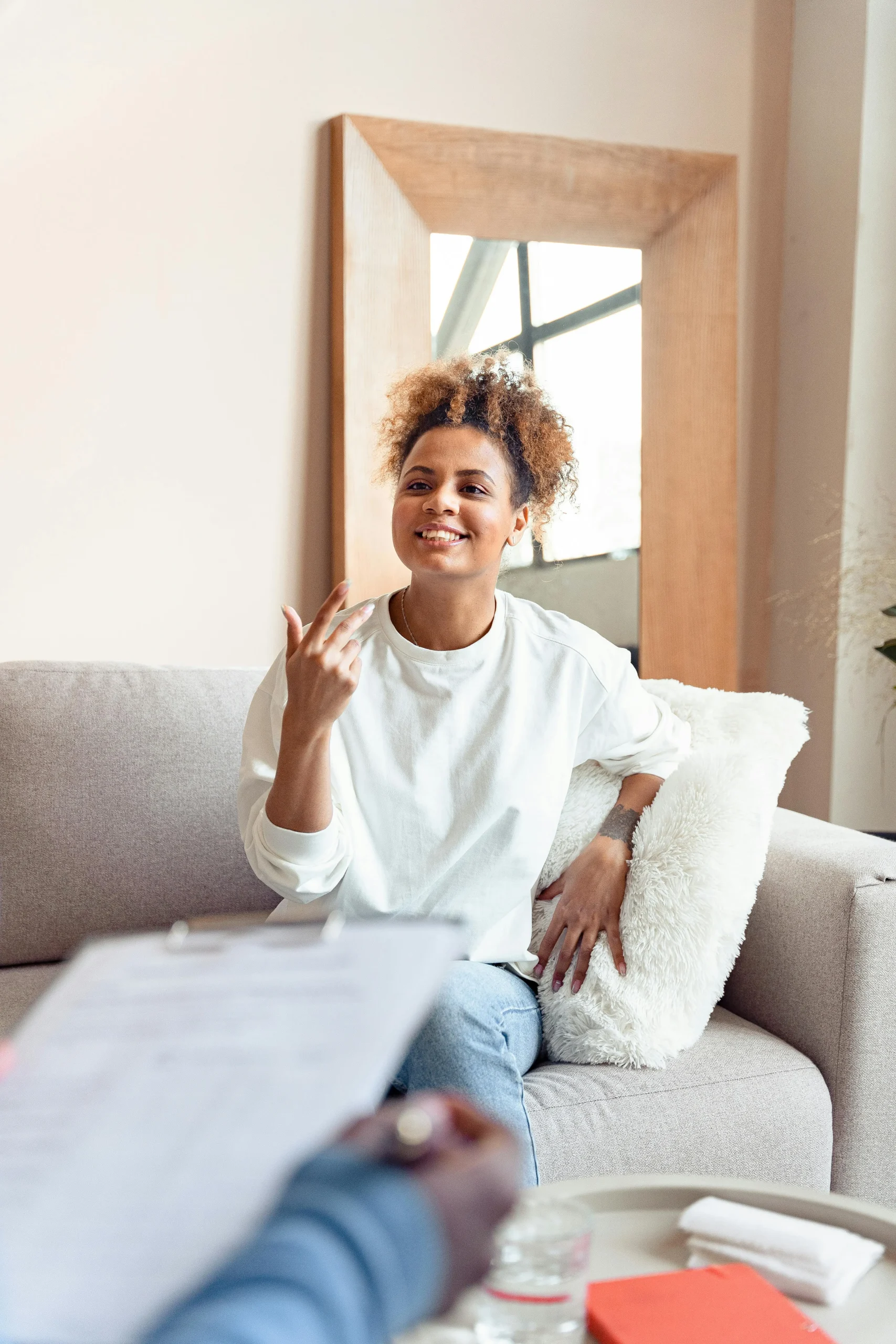 Warm, supportive conversation between client and therapist during individual counselling session by Calgary psychologist