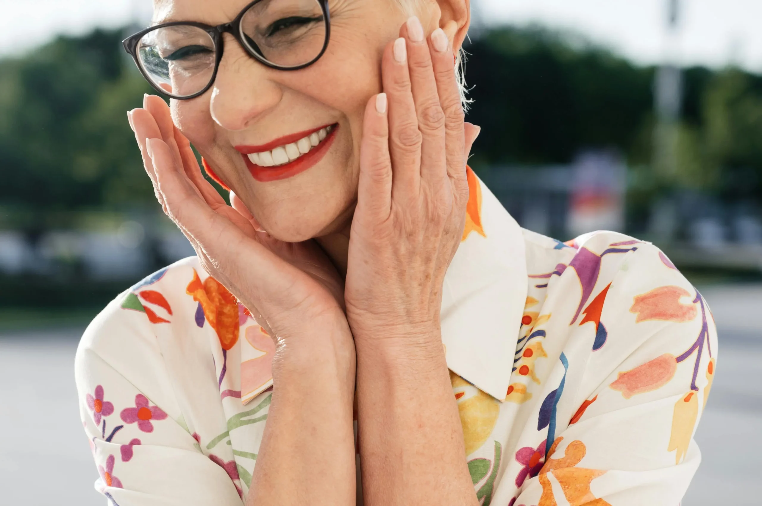 Older adult smiling outdoors, symbolising confidence and personal growth after therapy from Calgary psychologist