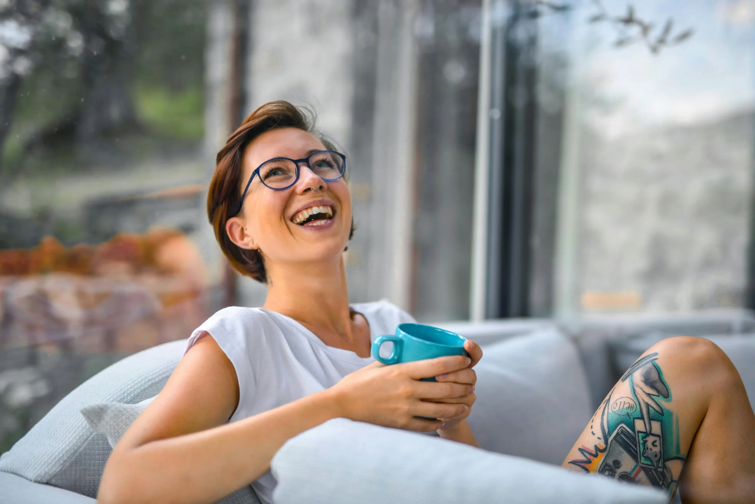 Woman looking relaxed and happy representing growth and healing through therapy with a Calgary psychologist