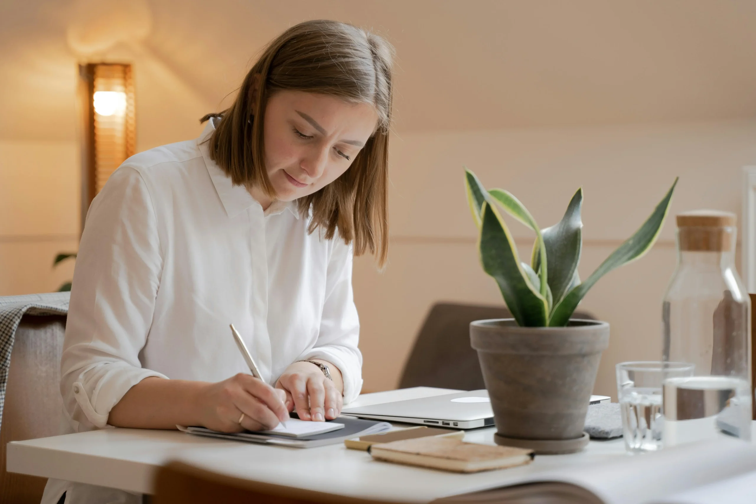 Woman concentrating on her work, applying strategies learnt from ADHD therapy in Calgary